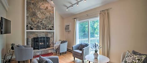 Plenty of space is available in the living room to relax and watch the smart TV with family and friends, and enjoy the high-speed internet in front of the decorative fireplace.