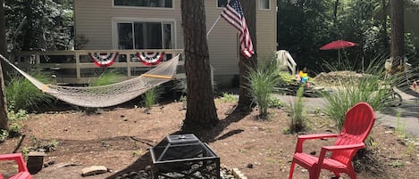 view from front yard towards house showing firepite