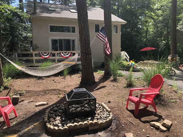 view from front yard towards house showing firepite