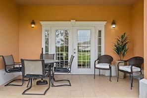 Elegant Balcony Retreat: with a Dining Table for 4 and Relaxation Chairs