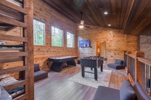 Multiple game table options in the upstairs game/bunk room