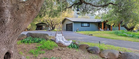 Relax under the oaks that give shade to this magical two-structure property. 