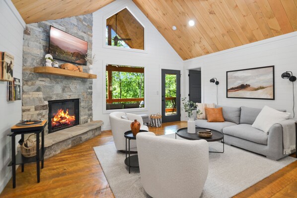 Open concept for enjoyment and relaxing with warm fireplace and natural light