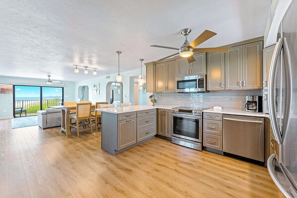 Modern, sleek, and stylish kitchen with stainless steel appliances.