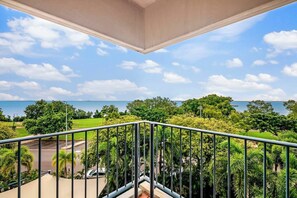 Enjoy the luxury of a private, furnished outdoor balcony with spectacular views over the tree tops and the water beyond
