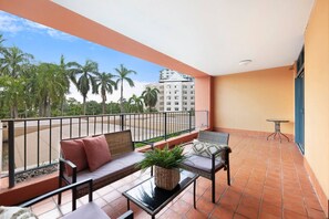 Step out onto your private balcony with views of the city and coverage against the elements
