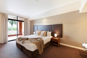Indulge in the primary bedroom with a spacious king bed and the added comfort of a TV for your entertainment.