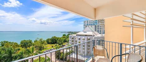 Step out onto your private, furnished balcony with views of the sea and coverage against the elements