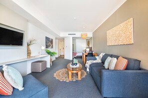 The modern design features modern furnishings and neutral tones
