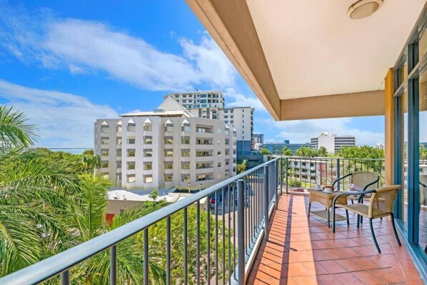 Enjoy the privacy of your own extensive and breezy outdoor balcony with ocean views and a table
