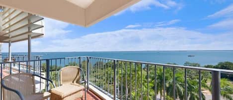 Enjoy the convenience of a private, furnished outdoor balcony overlooking the sparkling waters, with coverage against the elements.