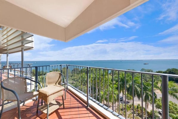 Enjoy the convenience of a private, furnished outdoor balcony overlooking the sparkling waters, with coverage against the elements.