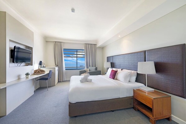 The spacious studio is well lit and includes a laptop-friendly workspace, a sitting area and water views out of the large window.