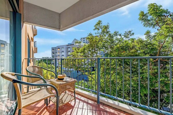 Take in lush tropical views from your sunny private balcony. There is a small table where you can enjoy your morning or an alfresco meal