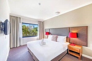In the bedroom, rest easy in a premium king-sized bed topped with hotel quality linens. There is air-conditioning and blackout blinds to ensure a good night’s sleep