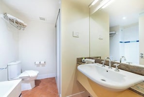 The apartment offers a well-appointed bathroom with complimentary toiletries for your stay.