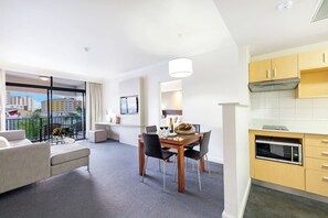 Unit 325 - A fully-equipped kitchen comes with a full-sized fridge, oven, electric stovetop, dishwasher and a microwave