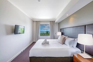 A large window in the first bedroom offers sparkling ocean views and streams of natural light.