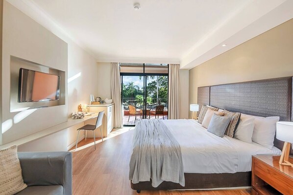 The spacious studio is well lit and includes a laptop-friendly workspace, LCD TV and a sitting area.