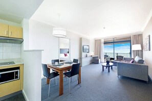 The one-bedroom apartment’s open-plan design allows for seamless indoor-outdoor living with water views.