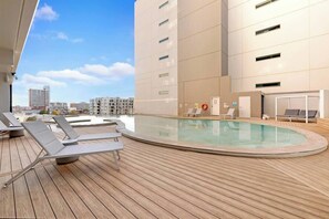 Cool down and make a splash in the shared outdoor swimming pool and spa. 