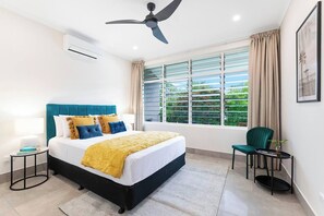 The master bedroom is set with a comfortable queen-sized bed and comes with built-in wardrobes for storing your belongings.
