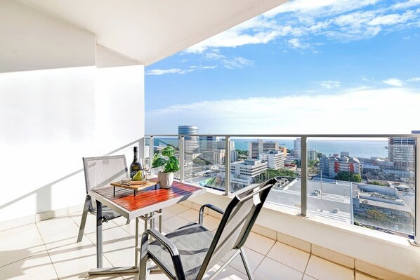Guests love hanging out on the balcony boasting panoramic city views and the ocean across.