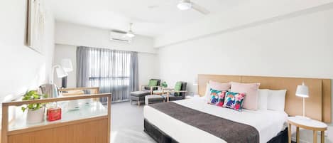 The spacious studio highlights a king-size bed, air-conditioning and two ceiling fans to keep things cool.
