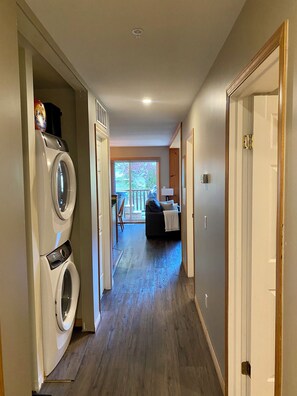 Large entrance way with front closet and washer/dryer