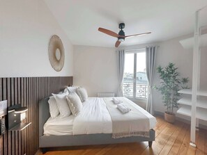 Bedroom full of light with fan