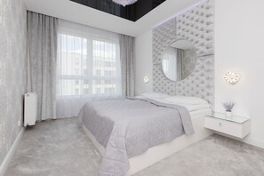 Bedroom with large double bed.