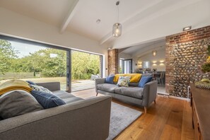The sitting area leads to the courtyard through the patio doors