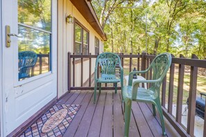 front deck with chairs, tiki torches and ashtray.  No smoking inside unit.