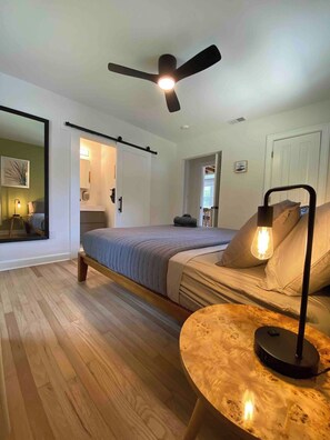Your Master bedroom with Thuma King bed, where a grand, oversized mirror reflects the room’s splendor, while the adjoining luxurious master bathroom beckons with its modern amenities. 