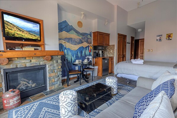 Welcome to Highland House 414, a charming Village studio with a gas fireplace and a balcony with wonderful views of The Village!