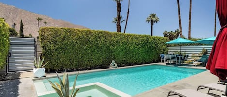 Sparkling pool and spa with San Jacinto Mountain views