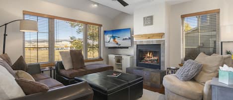 Smart TV, gas fireplace, cozy sofa and nice views