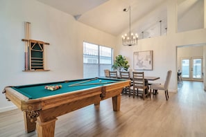Pool table and dining area as you walk in the door