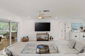 Bright and spacious living area with smart TV