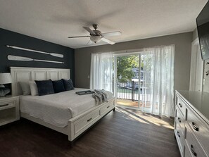 Escape to tranquility and get mesmerized in the beautiful lake view in this serene bedroom.