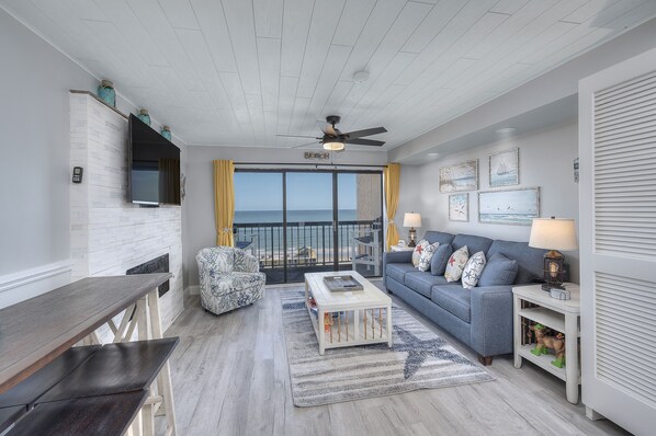 The ocean view  living room is fabulous for movie night with the family.