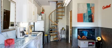 the main room and the kitchen