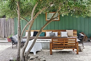 mediterranean courtyard fire pit/ sitting area