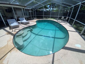 Private backyard and pool with screen, POOL NOT HEATED.