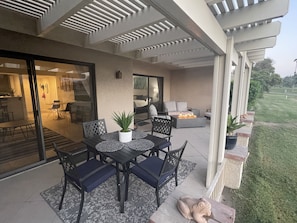 Dining table and a fire pit to relax by.