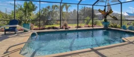 Pool with sunshelf for sitting and sipping