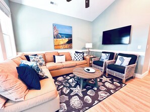 Grand Living Space with Large Flat Screen Smart TV loaded with Spectrum