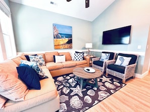 Grand Living Space with Large Flat Screen Smart TV loaded with Spectrum