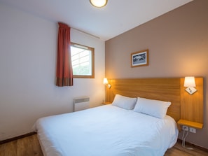 Experience a peaceful night's sleep in our tranquil and cosy bedroom.