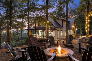 Fire pit located on left side of cabin when facing front of cabin